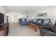 Comfortable living room with sofa set and access to kitchen at 1531 Placida Rd # 4-103, Englewood, FL 34223