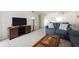 Comfortable living room boasts a sofa, tile floors, and an entertainment center at 1531 Placida Rd # 4-103, Englewood, FL 34223