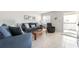Inviting living room with tile floors, a comfortable sofa set, and natural light streaming through the window at 1531 Placida Rd # 4-103, Englewood, FL 34223