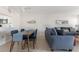 Open living space with dining table and sofa at 1531 Placida Rd # 4-103, Englewood, FL 34223