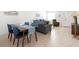 Open living space with dining table, sofa, and reclining chair at 1531 Placida Rd # 4-103, Englewood, FL 34223