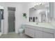 Contemporary bathroom with glass enclosed shower, sleek vanity, and ample natural light at 162 Fairway Rd, Rotonda West, FL 33947