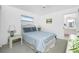 Cozy bedroom with soft natural light, carpeted floors, and attached bathroom at 162 Fairway Rd, Rotonda West, FL 33947