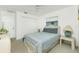 Comfortable bedroom featuring a queen bed, neutral carpet, natural light, and closet at 162 Fairway Rd, Rotonda West, FL 33947