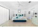 Bright bedroom with a king bed, tile floor, complemented by soft natural light and stylish decor at 162 Fairway Rd, Rotonda West, FL 33947