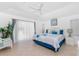 Serene bedroom featuring a king-size bed, tile floor, and sliding glass door to a private outdoor space at 162 Fairway Rd, Rotonda West, FL 33947
