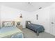Bedroom with twin beds, ceiling fan, and ample natural light from the large window at 162 Fairway Rd, Rotonda West, FL 33947