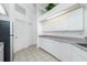 Clean kitchen with white cabinets and appliances and tile flooring at 162 Fairway Rd, Rotonda West, FL 33947