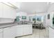 Modern kitchen flows into dining area and features lots of natural light and an open layout at 162 Fairway Rd, Rotonda West, FL 33947