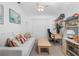 Inviting living room with comfortable seating, bright natural light, and a functional workspace at 162 Fairway Rd, Rotonda West, FL 33947