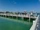 Beautiful Boat Dock and lift featuring multiple boats docked along the water way at 16716 Grande Quay Dr, Boca Grande, FL 33921
