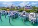 This waterfront home offers direct boating access with a private boat lift for easy water excursions at 16716 Grande Quay Dr, Boca Grande, FL 33921