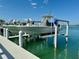 Close-up of the boat lift, providing easy access to waterfront activities and boating adventures at 16716 Grande Quay Dr, Boca Grande, FL 33921