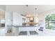 Kitchen with granite countertops, stainless steel appliances, and barstool seating with views of the outdoor scenery at 16716 Grande Quay Dr, Boca Grande, FL 33921