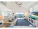 Living room with large picture windows, lots of light, ceiling fan and a comfortable leather sectional at 16716 Grande Quay Dr, Boca Grande, FL 33921