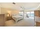 Spacious main bedroom boasts stunning water views, sitting area, and neutral decor at 16716 Grande Quay Dr, Boca Grande, FL 33921