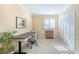 Home office with neutral walls and an adjustable desk at 16716 Grande Quay Dr, Boca Grande, FL 33921