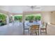 Large covered patio featuring outdoor seating and views of the lush landscaping at 16716 Grande Quay Dr, Boca Grande, FL 33921