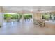 Expansive covered patio offers a relaxing outdoor space with beautiful garden views and seating at 16716 Grande Quay Dr, Boca Grande, FL 33921