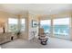 Inviting sitting area in the main bedroom has water views at 16716 Grande Quay Dr, Boca Grande, FL 33921