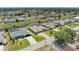 Aerial view of home featuring backyard canal access and a well maintained lawn at 169 Fairway Rd, Rotonda West, FL 33947