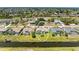 An aerial view of the property showcases its canal-front location in a residential neighborhood at 169 Fairway Rd, Rotonda West, FL 33947
