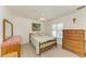 Bedroom featuring a bed, ceiling fan, and dressers at 169 Fairway Rd, Rotonda West, FL 33947