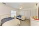 Bedroom featuring two twin beds, ceiling fan, and closet at 169 Fairway Rd, Rotonda West, FL 33947