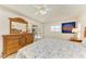 Inviting bedroom showcasing a wooden bed set and access to the outdoor patio at 169 Fairway Rd, Rotonda West, FL 33947