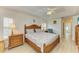 Bright bedroom featuring a wooden bed set, neutral walls, and lots of natural light at 169 Fairway Rd, Rotonda West, FL 33947