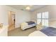 Bedroom featuring two twin beds, ceiling fan, and window with shutters at 169 Fairway Rd, Rotonda West, FL 33947