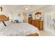 Comfortable bedroom with a wooden bed set and access to outdoor patio through sliding glass doors at 169 Fairway Rd, Rotonda West, FL 33947
