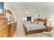 Cozy bedroom with wood furniture, a ceiling fan, and a bright, airy ambiance at 169 Fairway Rd, Rotonda West, FL 33947