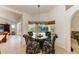 Charming breakfast nook with pool view and floral upholstered chairs at 169 Fairway Rd, Rotonda West, FL 33947