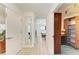 Hallway includes closet area and leads to bedroom with a ceiling fan at 169 Fairway Rd, Rotonda West, FL 33947