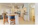 Bright kitchen featuring stainless steel appliances, tiled floors and seamless access to the living room at 169 Fairway Rd, Rotonda West, FL 33947