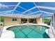 Inviting screened in swimming pool and patio, ideal for outdoor relaxation and entertaining at 169 Fairway Rd, Rotonda West, FL 33947