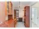 Walk-in closet with custom shelving and cabinetry, offering ample storage and organization at 169 Fairway Rd, Rotonda West, FL 33947