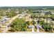 Community aerial view showcasing lush tree coverage and neighborhood layout at 1962 Remus Ave, North Port, FL 34286