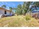 Expansive backyard featuring lush greenery and a charming outdoor area perfect for entertaining at 1962 Remus Ave, North Port, FL 34286