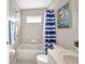Well-maintained bathroom with a shower-tub combo and essential fixtures at 1962 Remus Ave, North Port, FL 34286