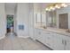 Spacious bathroom with double sinks, ample counter space, and a separate shower area at 1962 Remus Ave, North Port, FL 34286