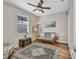 Bright bedroom featuring a ceiling fan and wood-look floors at 1962 Remus Ave, North Port, FL 34286