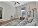 Cozy bedroom featuring wood floors, a chair, and a beautiful patterned rug at 1962 Remus Ave, North Port, FL 34286