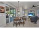 Cozy dining area adjacent to a large sliding glass door with a view of the lanai at 1962 Remus Ave, North Port, FL 34286