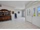 Spacious foyer featuring tiled flooring and natural light, perfect for welcoming guests at 1962 Remus Ave, North Port, FL 34286