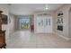 Open-concept foyer with tile flooring and a view of the front door and living spaces at 1962 Remus Ave, North Port, FL 34286