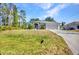 Beautiful single-story home with a well-manicured lawn and lush landscaping at 1962 Remus Ave, North Port, FL 34286