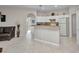 The eat-in kitchen offers lots of cabinets and an extended countertop at 1962 Remus Ave, North Port, FL 34286