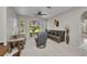 Spacious living room with tile floors, bright windows, and comfortable seating at 1962 Remus Ave, North Port, FL 34286